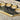 brass knuckles engraved with “we the people” on top of Constitution