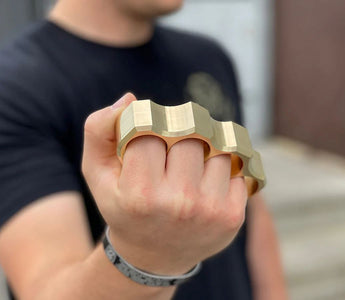 brass knuckles on fist