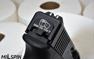 Glock back plate with engraving of toilet paper roll and text “COME AND TAKE IT”