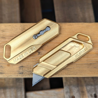 Brass utility knife with snmooth sliding locking button that has three locking positions