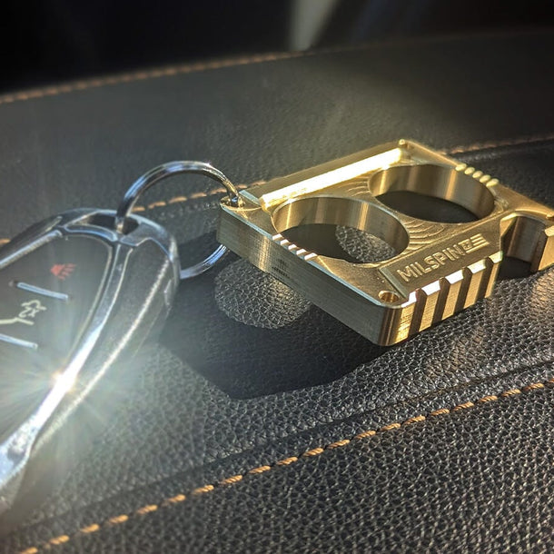 Two Finger Brass Knuckles Cassette Paperweight MILSPIN